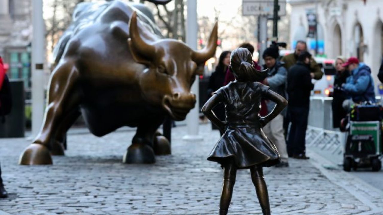 NEW YORK, March 9, 2017 :   Photo taken on March 9, 2017 shows the "fearless girl" statue facing the bronze bull statue near the Wall Street in New York, the United States. The "fearless girl" was put there by an investment firm which said the idea was to call attention to the lack of gender diversity in management of companies as well as how few women work in financial services, and the fact that they get paid less than men. (Xinhua/Wang Ying via Getty Images)